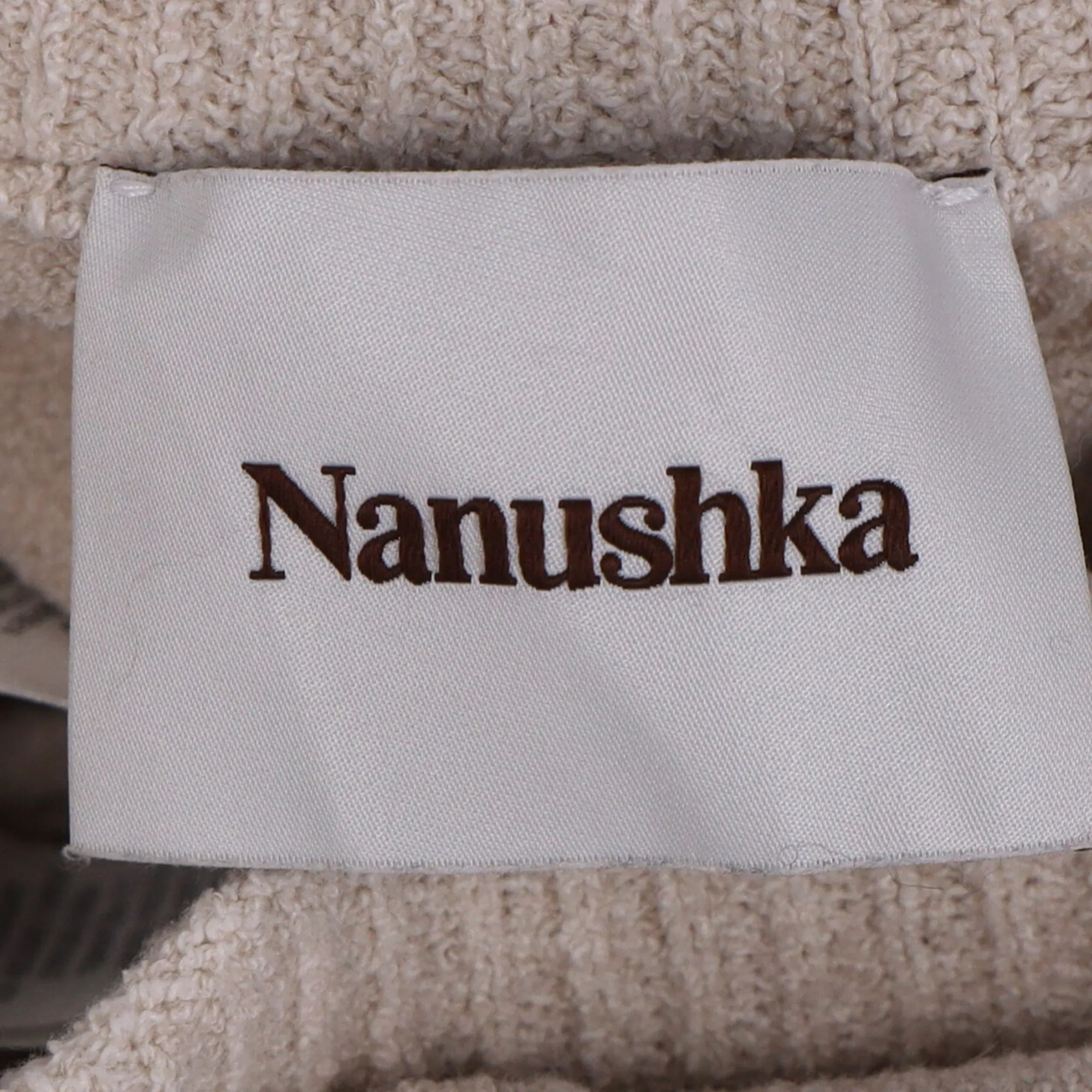 Nanushka Strick-Hochwaist-Glockenhose in beiger Baumwolle