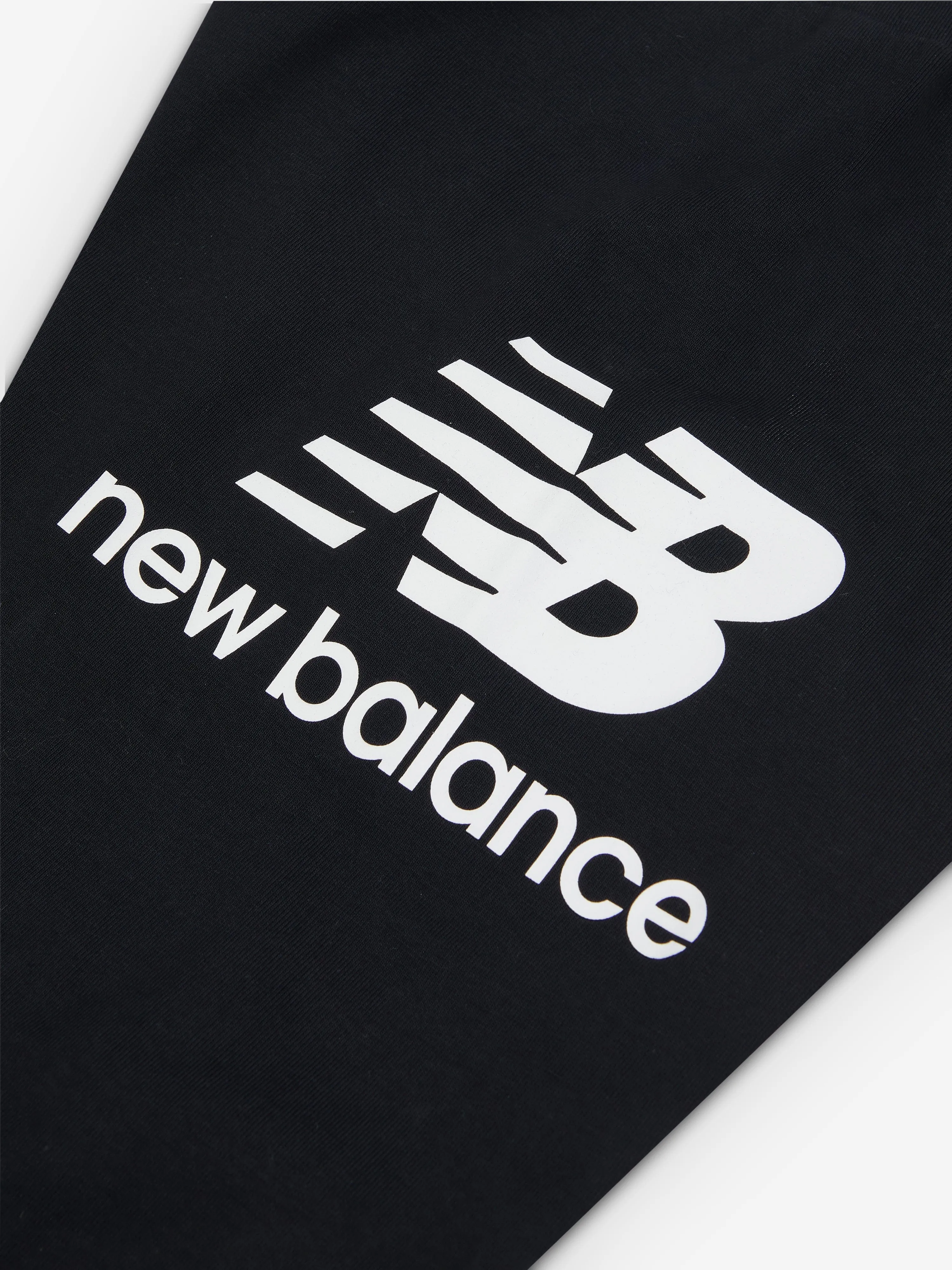 New Balance Mädchen Leggings mit gestapeltem Logo in Schwarz